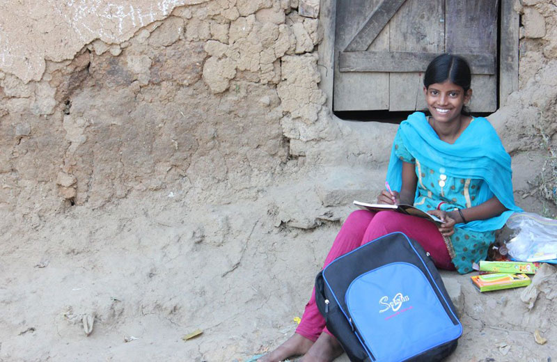A young girl studies at a SEESHA learning centre